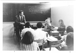Psychology Professor Frank Oja leads a class discussion in a basement classroom in Tewksbury, 1965.