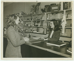 Janice Weitz ’48 waits on a student in the College Store in Hegeman, ca. 1947.