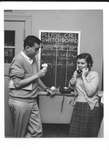 Sherman Yellen ‘53 and an unidentified student share ice cream, probably near the Hegeman coffee shop, ca. 1950s.