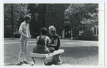 Professor William Driver talks with students on campus, ca. 1981.