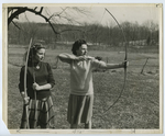 Two women identified as Dorothy Lasker ’48 and Margery (Jerry) Rosenblum ’48 practice archery on campus, late 1940s.