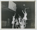 Six unidentified women play basketball in the Memorial Gymnasium, ca. 1950.